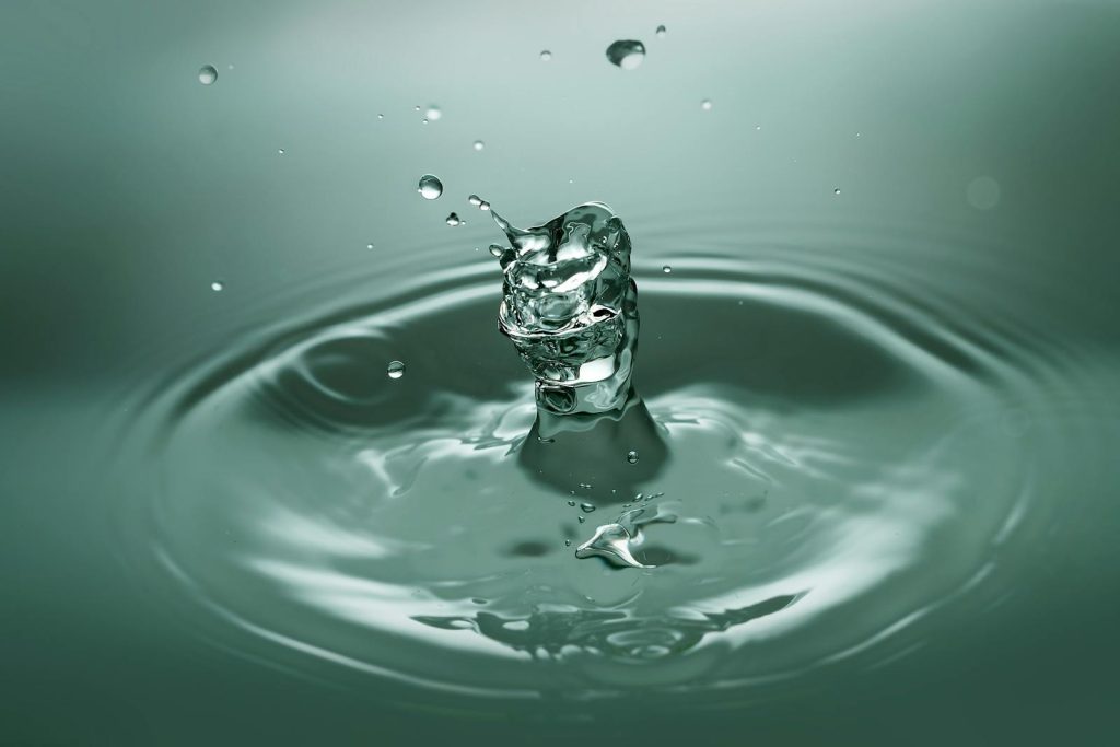 Close-up of Drop Splashing in Water